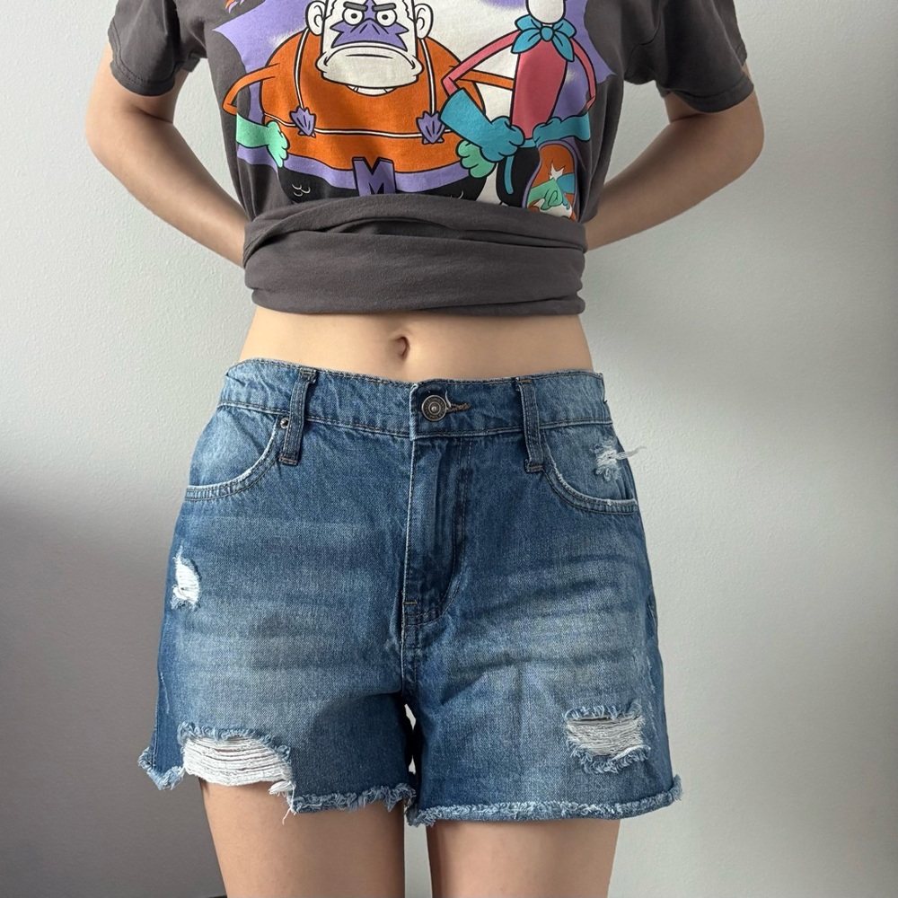 High-waisted denim shorts with a distressed look